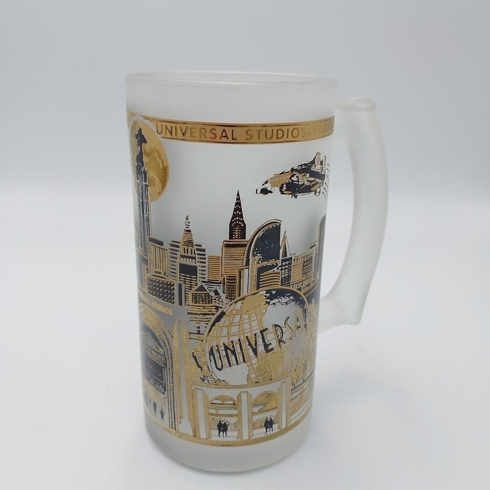Universal Studios Florida Gold & Black On Frosted Glass Beverage Mug 1990’s‎